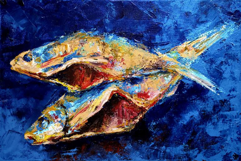 Two dry fishes on the table